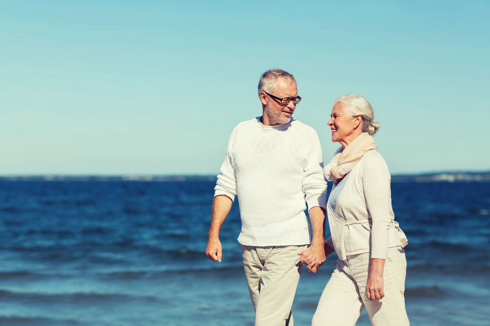 Older Couple Walking Along the Water